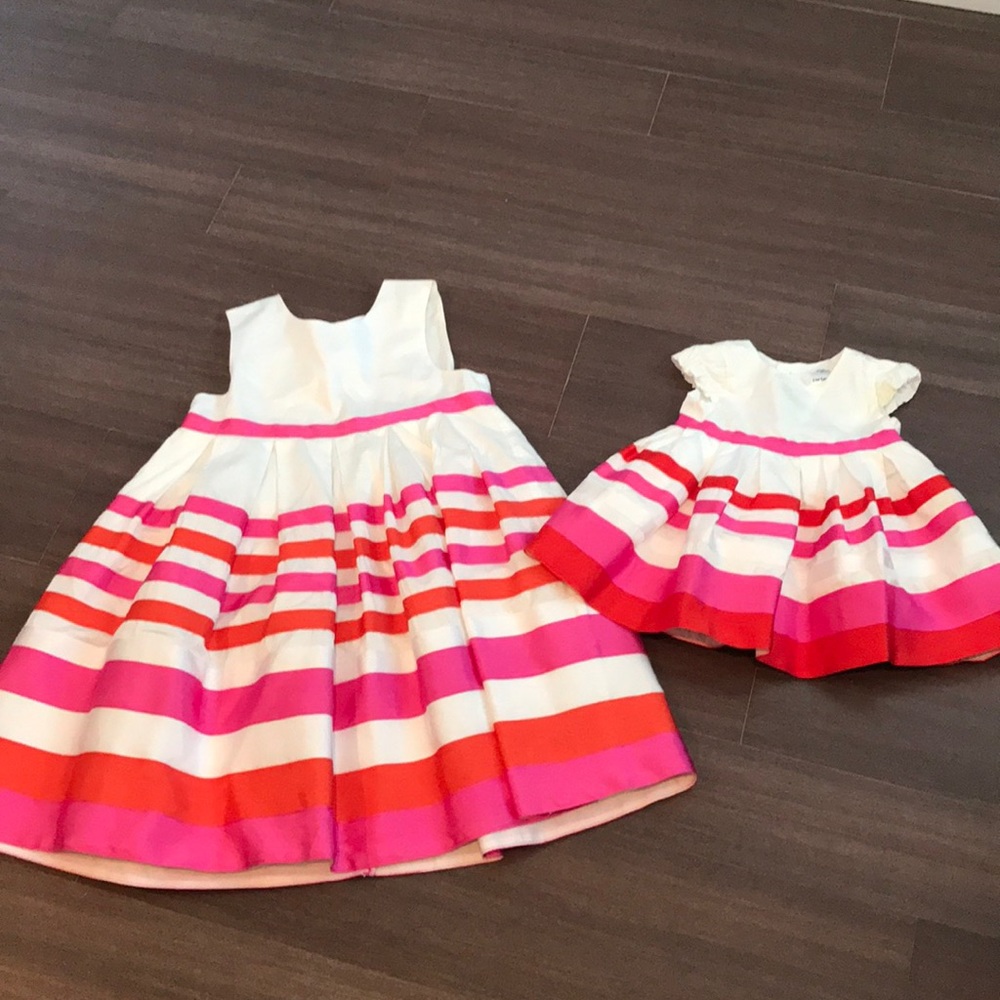 Adorable Matching girl’s’ dresses from Carters.